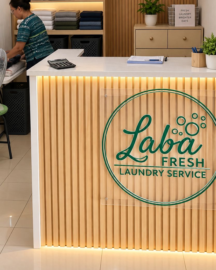 The Laba Fresh front counter, with the logo on its wood-slat panel and folded laundry on the shelves behind